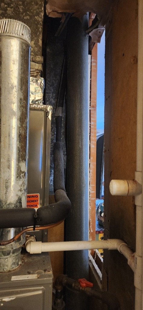 Old damaged clay tile chimney liner before relining